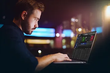A cheerful woman in traditional clothing using her smartphone during a festive moment, showing how easily the LUCK789 app fits into everyday life.
